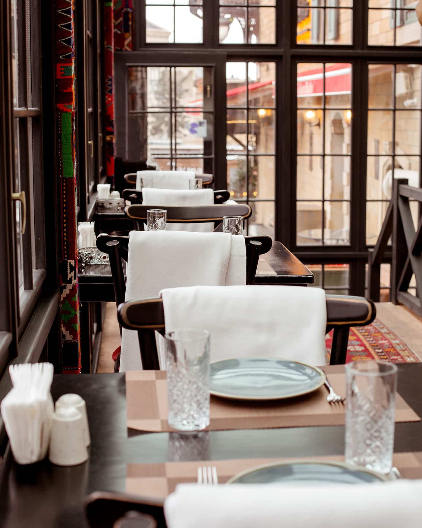 restaurant with red carpet floor tables chairs