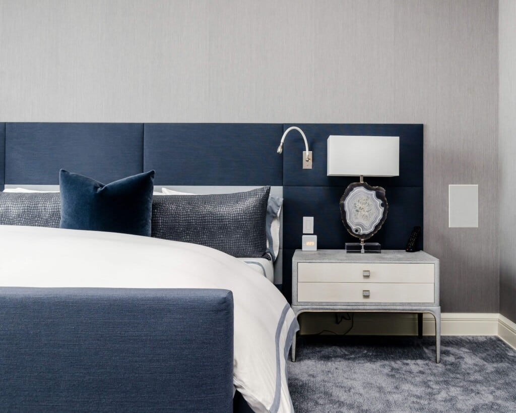 hotel bed with night stand and lamp