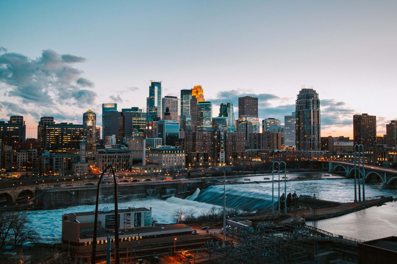 A stunning view of the Minneapolis skyline with the river running through the city.